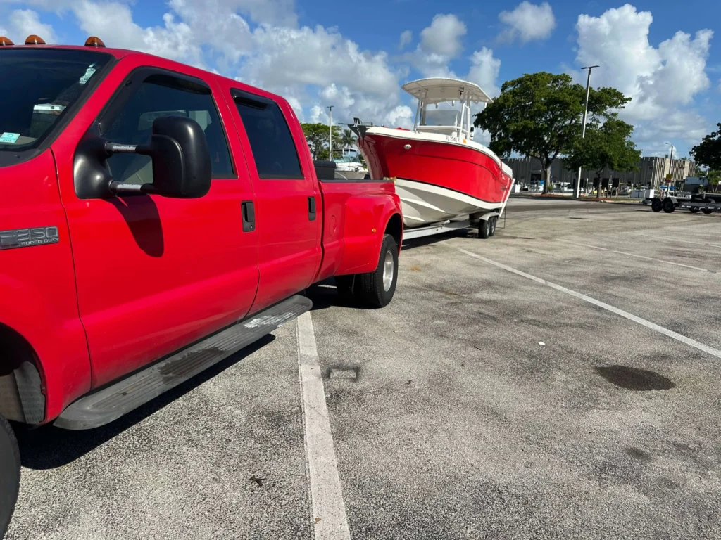 Frontier Marine mobile service vehicle transporting a vessel in Broward County